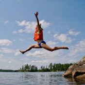 woman jumping into the water- releasing her inner child