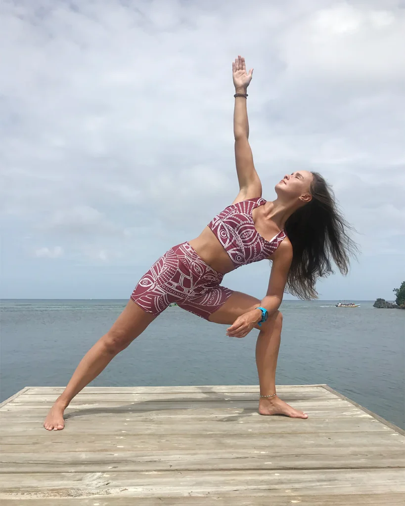 Yogini feeling the power of yoga while reducing stress. She is wearing dancing vishnu
